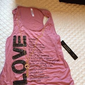 A shirt that saids love with an inspiring message.